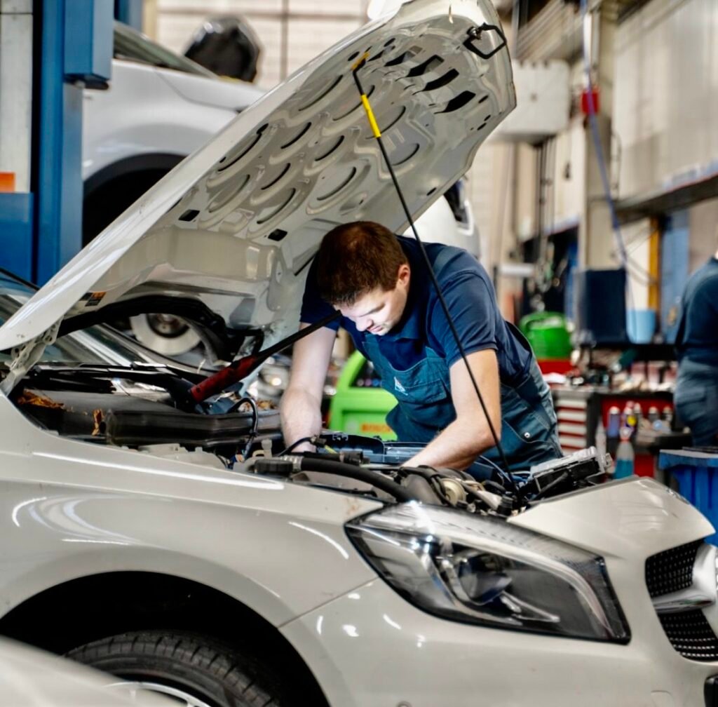 MECHANIC CHECKING CAR